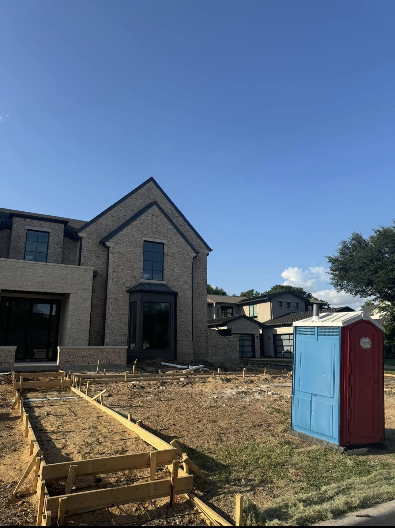 After: tree stripped and under removal at construction site